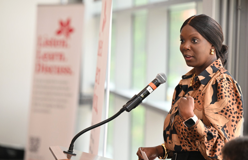 Ohio State Senior Vice President of Student Life, Dr. Melissa Shivers, speaks behind a podium at The Big Table event.